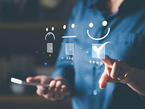 Hand of client show a feedback with smiley face. Service rating, satisfaction concept. Customer service evaluation. Asian female hand with emoticon smile in satisfaction.